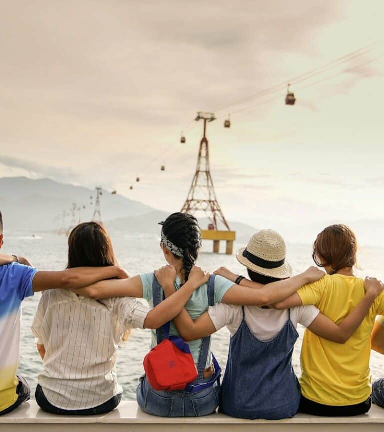 Diverse group of friends laughing together outdoors