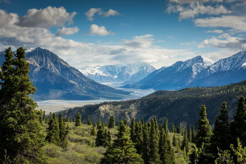 Mountain landscape with green valley and hiking trail
